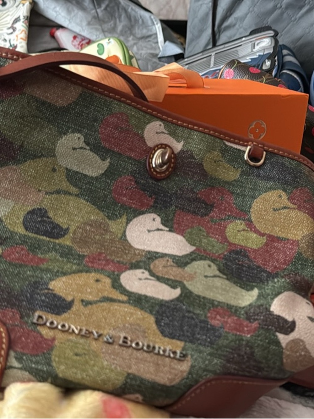 Dooney and Bourke . From 2014 autographed by the ladies of Duck Dynasty.